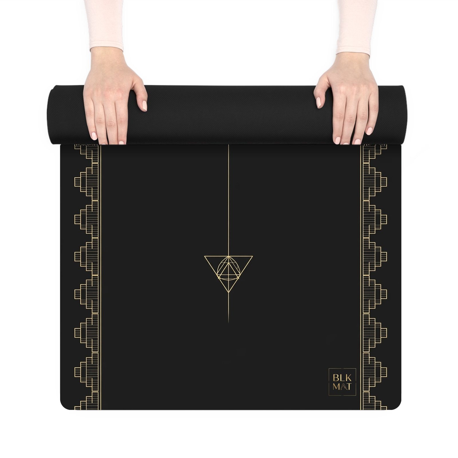 BLKMAT Astral Bindu yoga mat, held up and partly rolled
