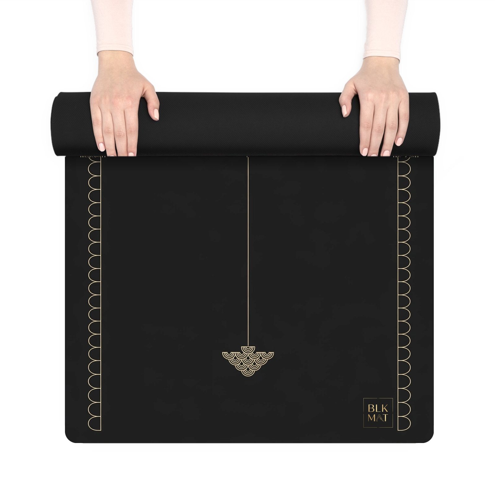 BLKMAT Auspicious Umbrella yoga mat, held up and partly rolled