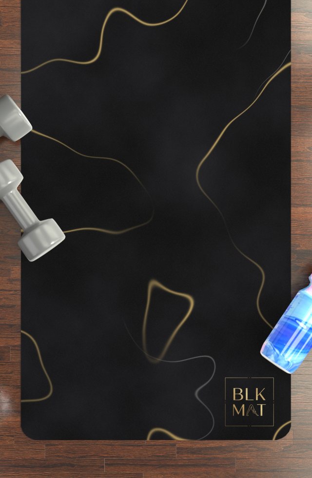 BLKMAT Black Marble, Gold Vein yoga mat, flat lay on a wood floor