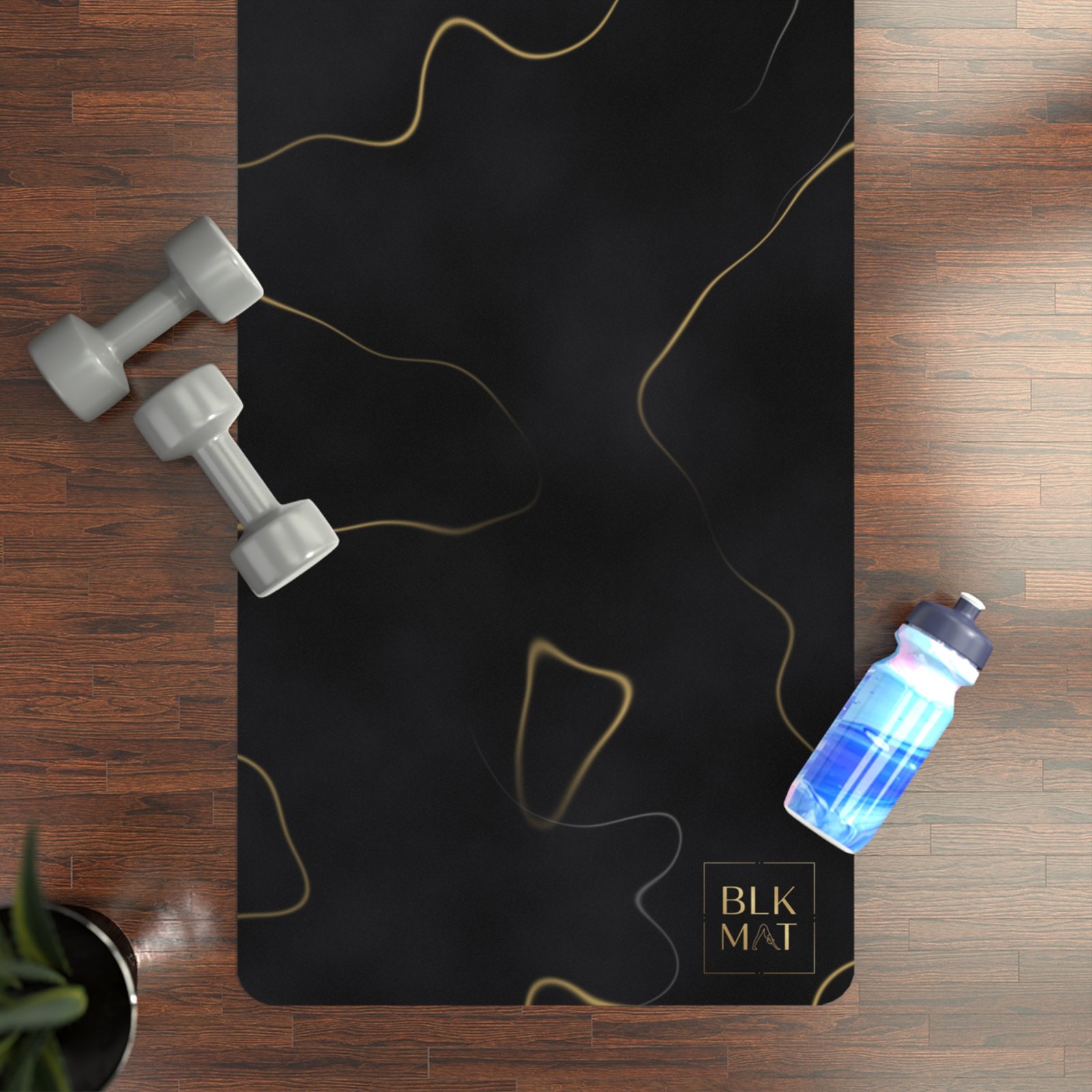 BLKMAT Black Marble, Gold Vein yoga mat, flat lay on a wood floor