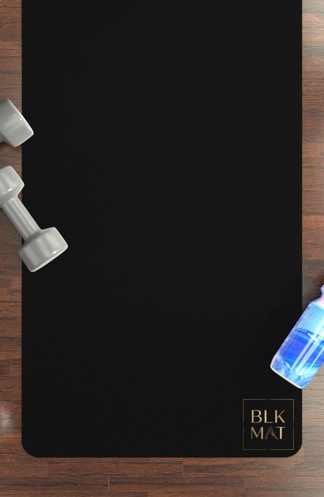 BLKMAT Breath Rings yoga mat, flat lay on a wood floor