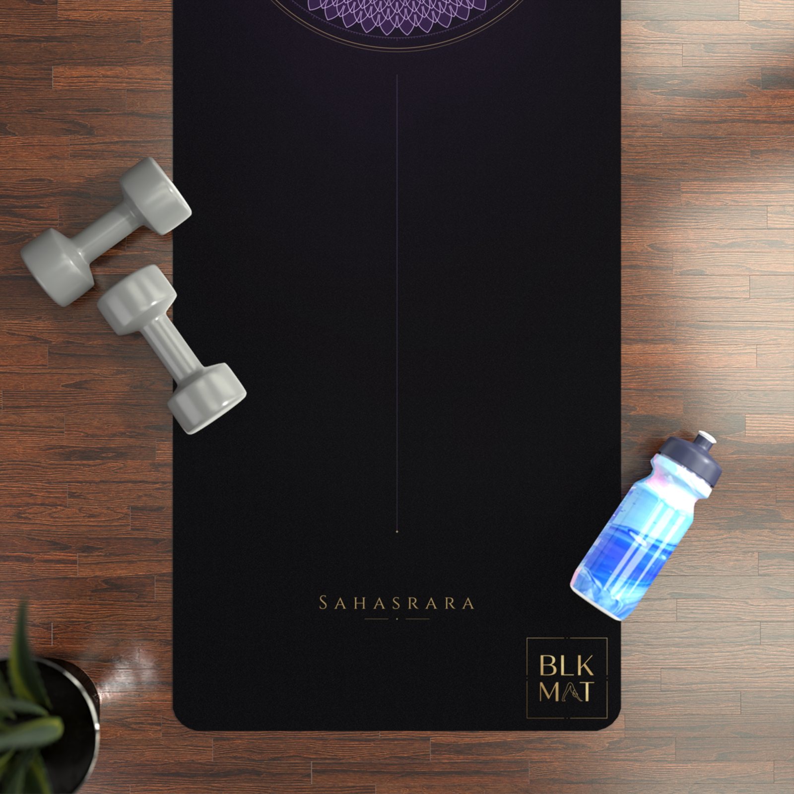 BLKMAT Crown Chakra yoga mat, flat lay on a wood floor