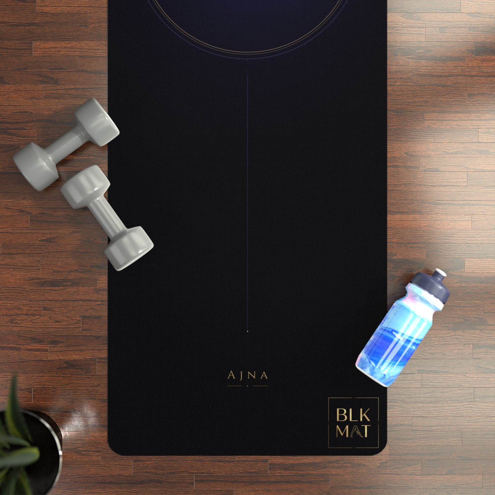 BLKMAT Third Eye Chakra yoga mat, flat lay on a wood floor