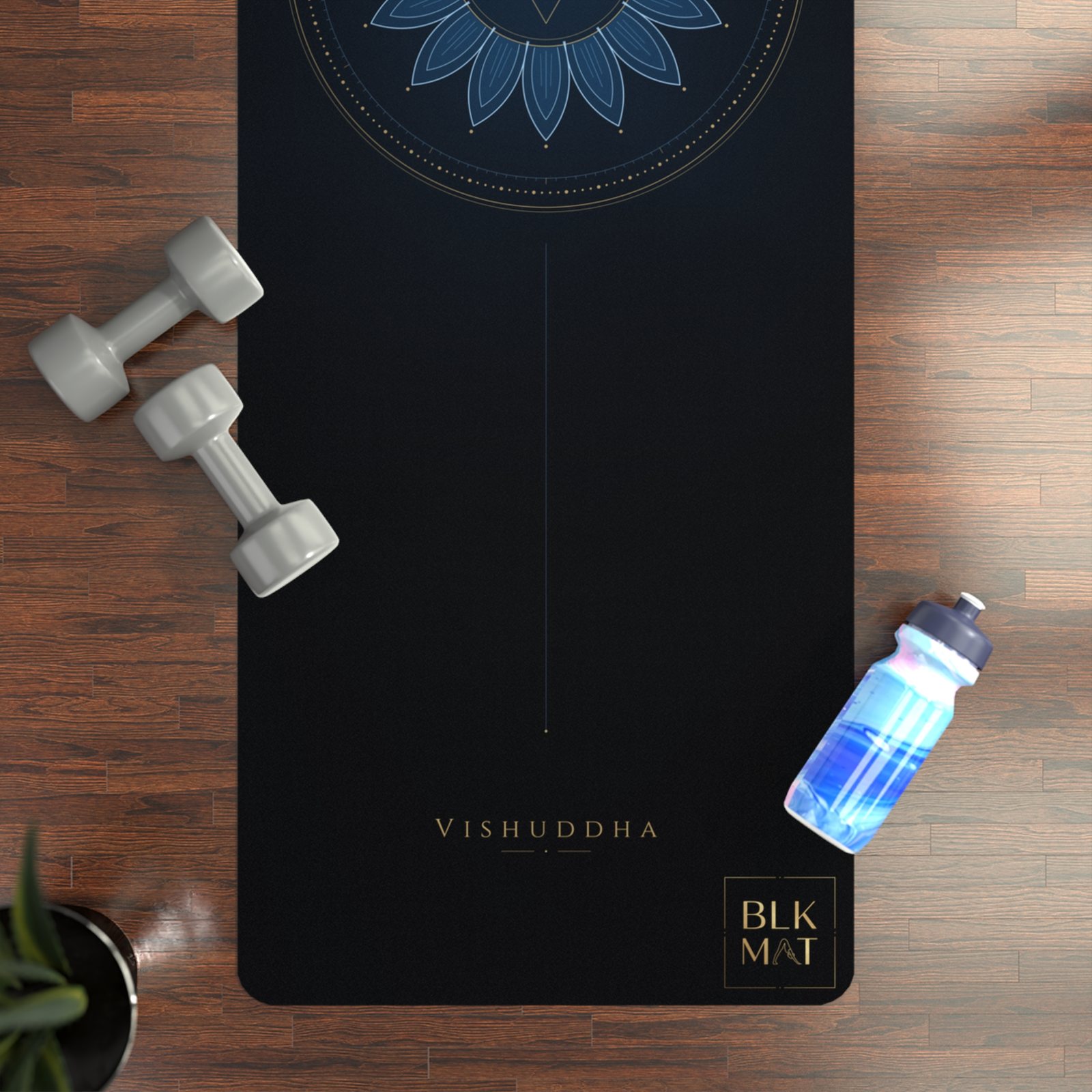 BLKMAT Throat Chakra yoga mat, flat lay on a wood floor