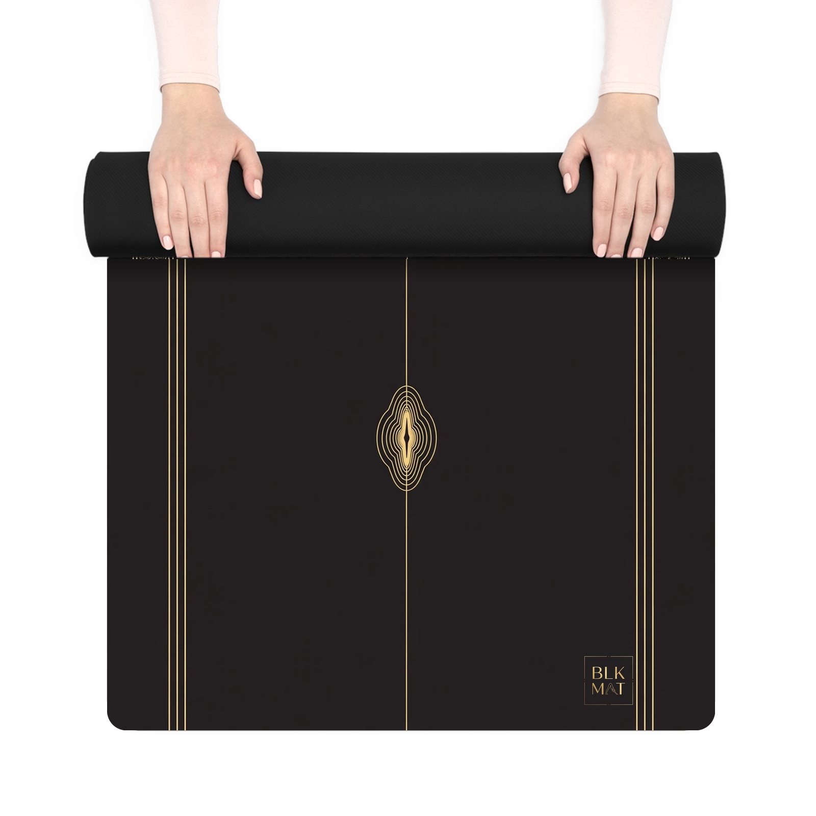 BLKMAT Coastal Canyon yoga mat, held up and partly rolled