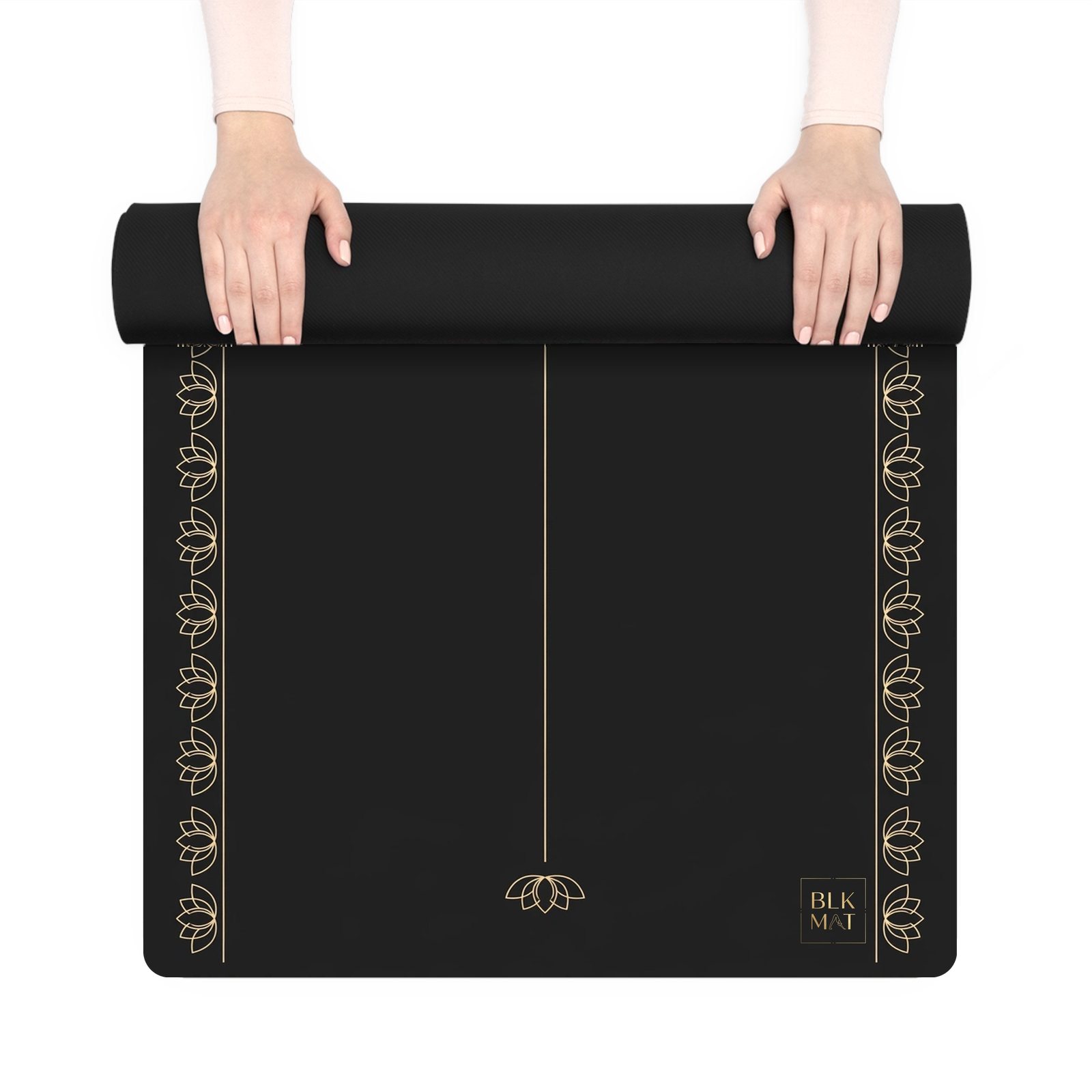 BLKMAT Dharma Wheel yoga mat, held up and partly rolled