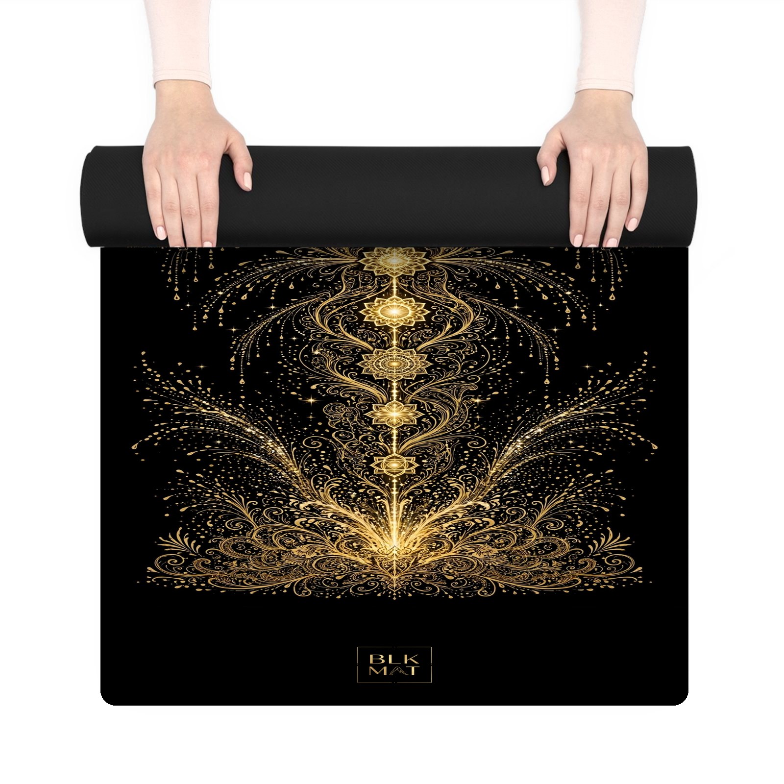 BLKMAT Energy Fountain Chakras yoga mat, held up and partly rolled