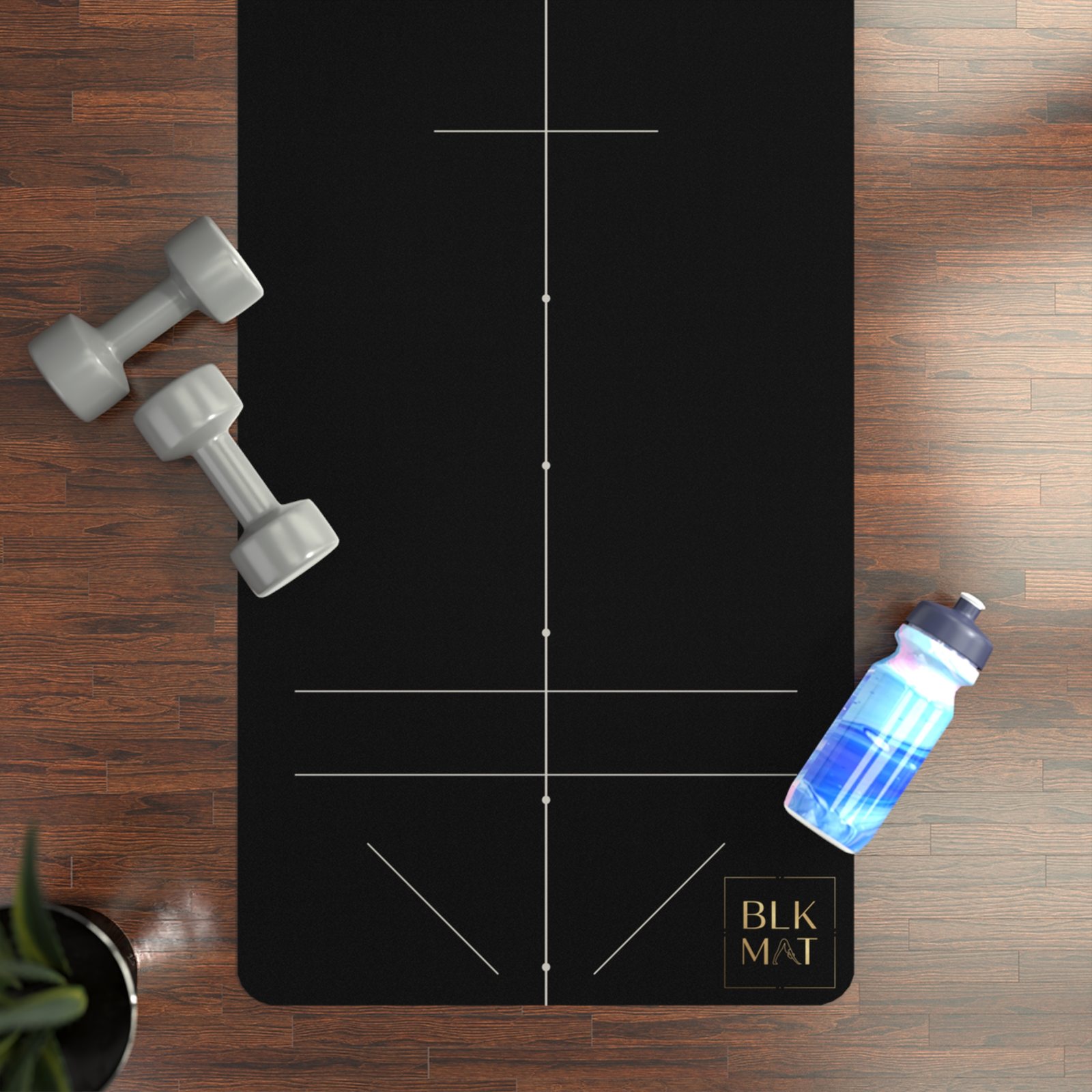 BLKMAT Fine-Line Alignment yoga mat, flat lay on a wood floor