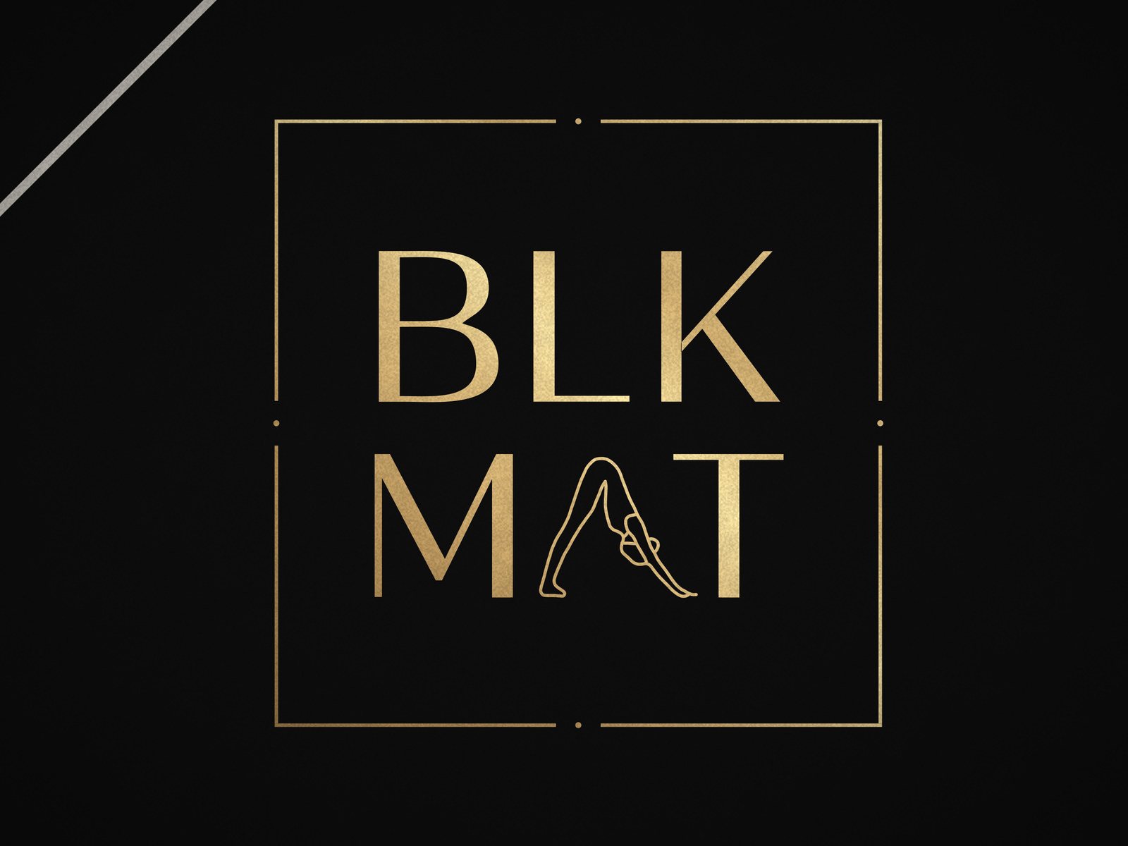 BLKMAT Fine-Line Alignment yoga mat, close-up of the BLKMAT corner logo