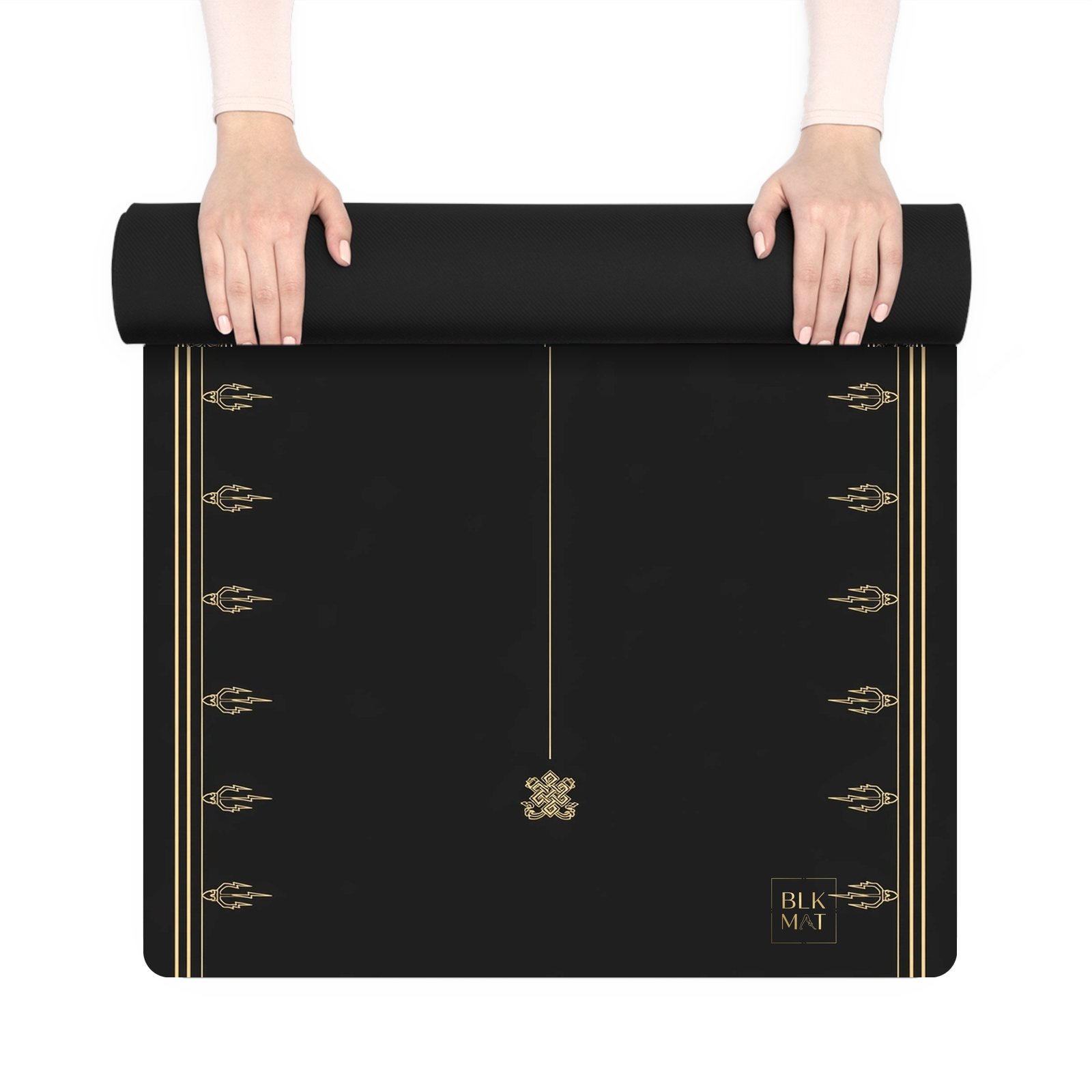 BLKMAT Flame Dorje yoga mat, held up and partly rolled