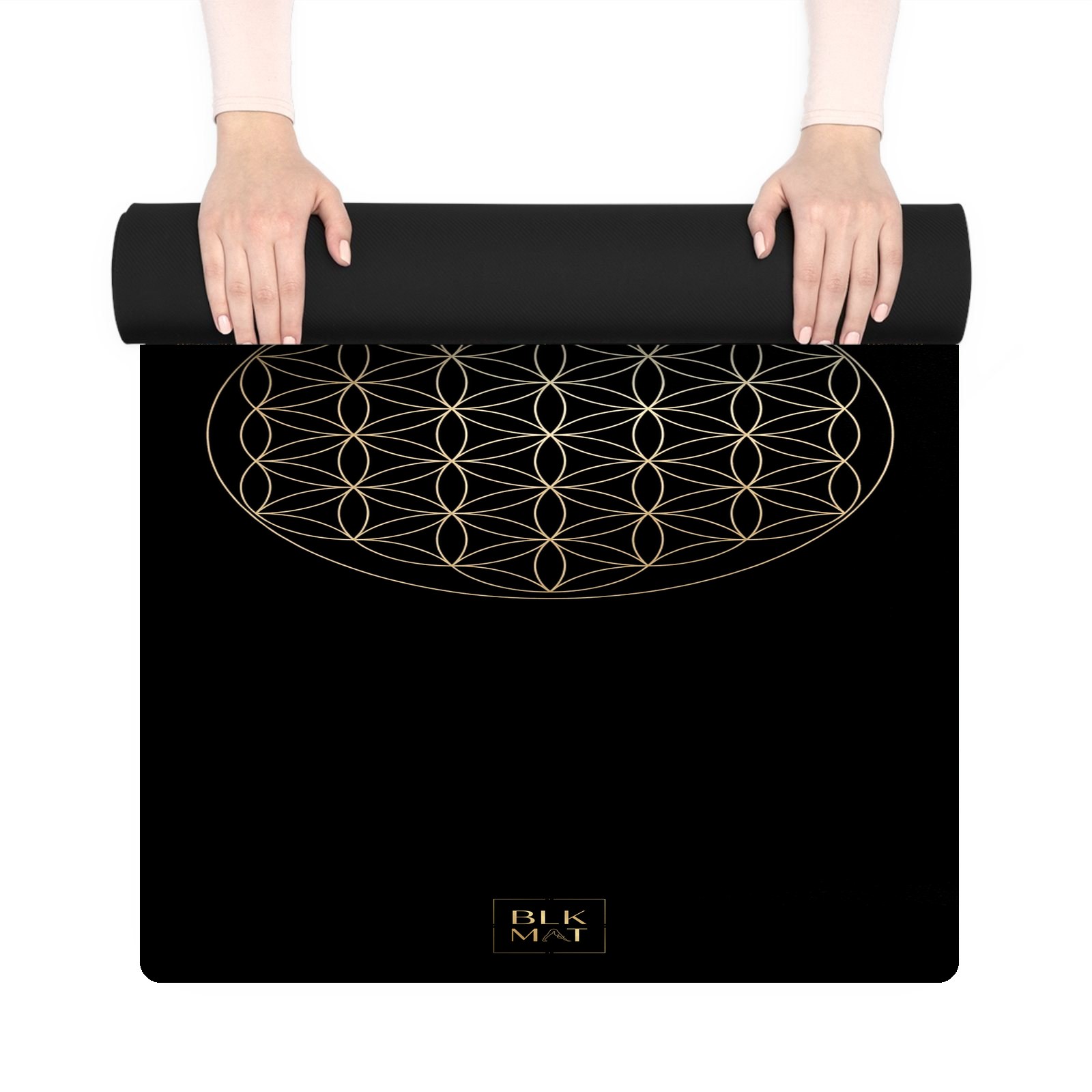 BLKMAT Flower of Life yoga mat, held up and partly rolled