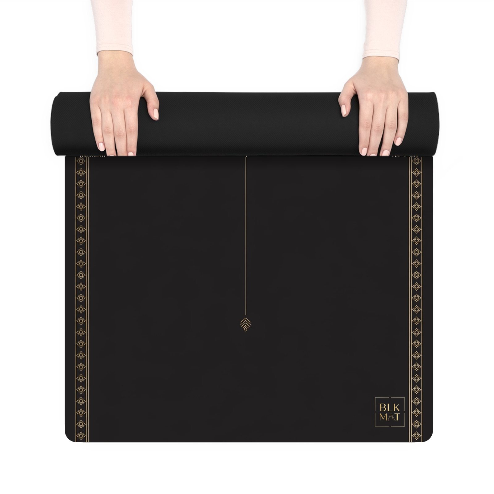 BLKMAT Heart Sanctuary yoga mat, held up and partly rolled