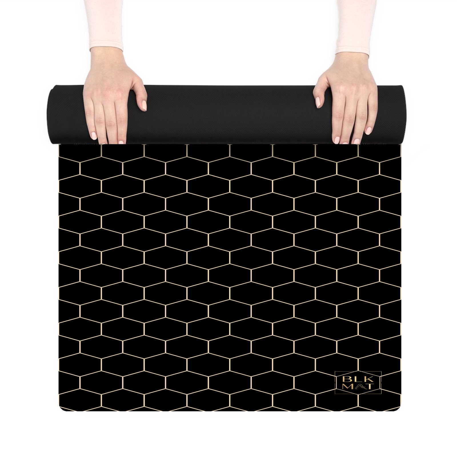 BLKMAT Honeycomb Hex Lattice yoga mat, held up and partly rolled