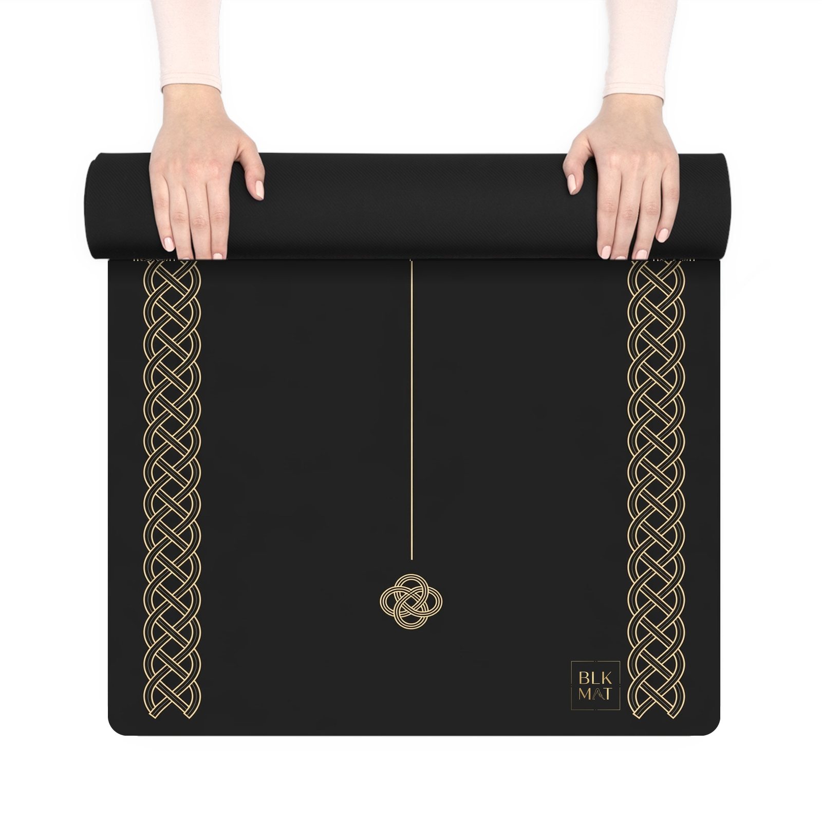 BLKMAT Infinite Thread yoga mat, held up and partly rolled