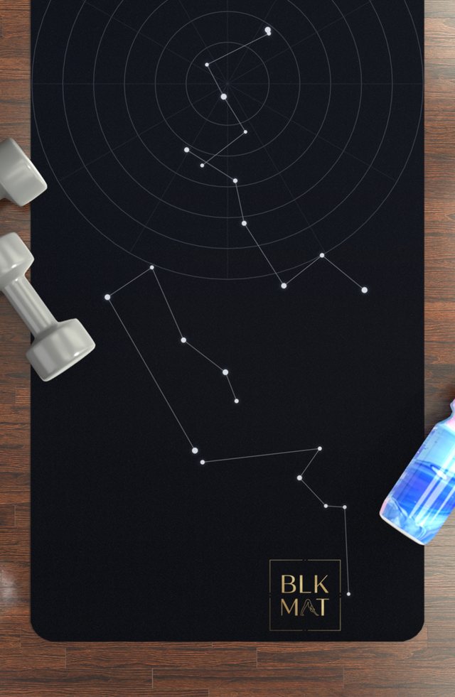 BLKMAT Night Chart yoga mat, flat lay on a wood floor