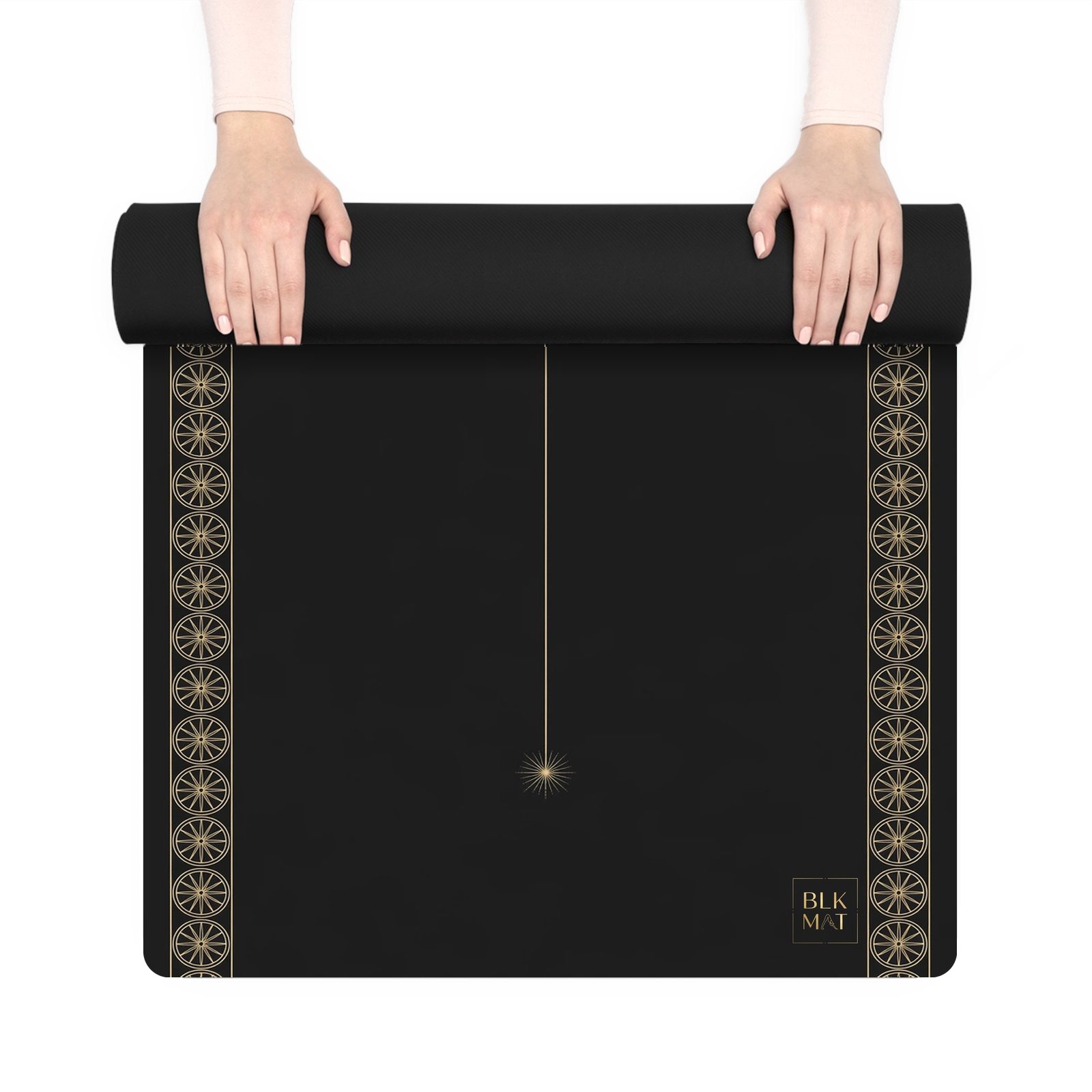 BLKMAT Kalachakra Star yoga mat, held up and partly rolled