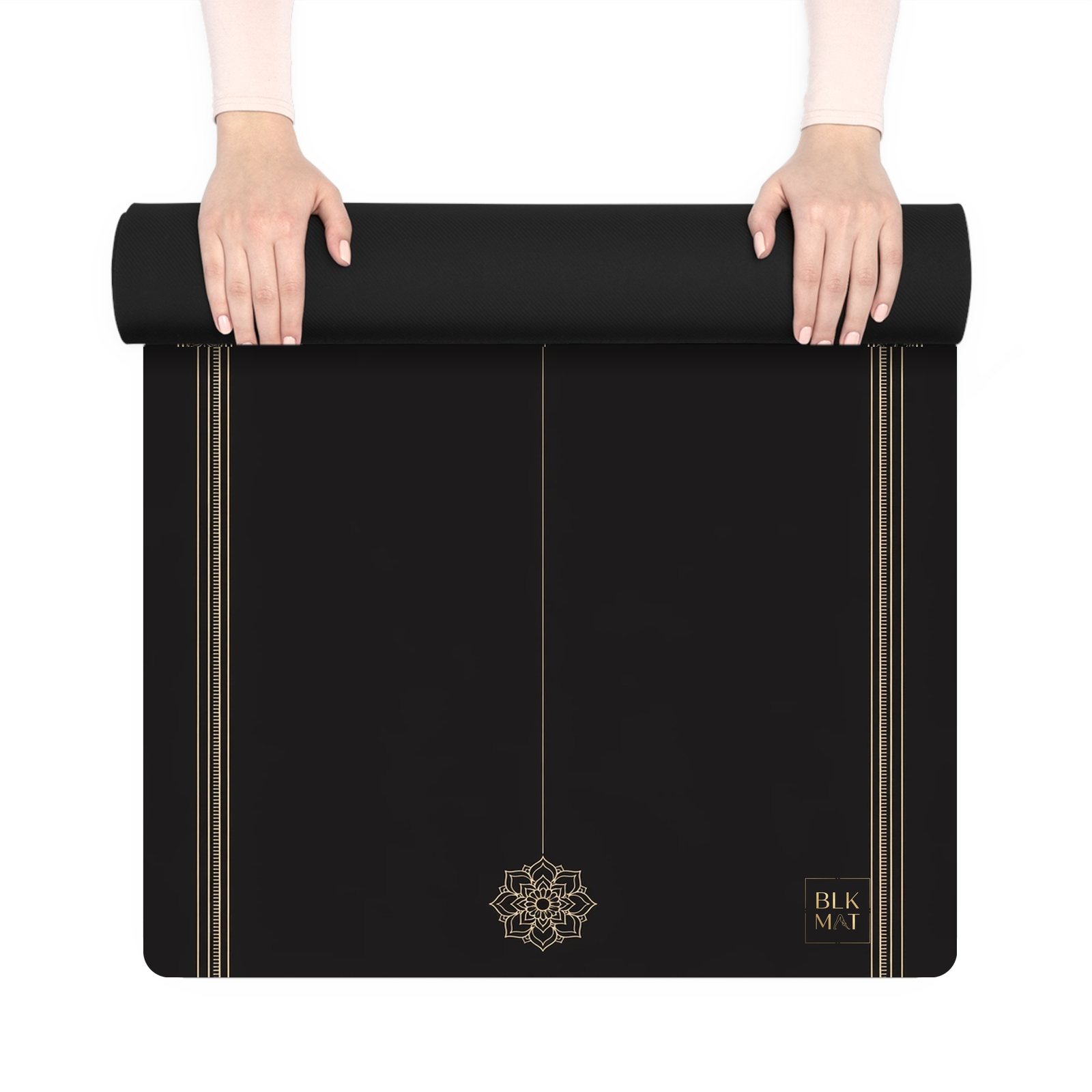 BLKMAT Lotus Mandala yoga mat, held up and partly rolled