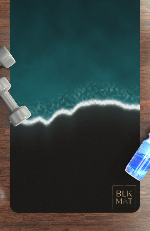 BLKMAT Ocean Tide yoga mat, flat lay on a wood floor