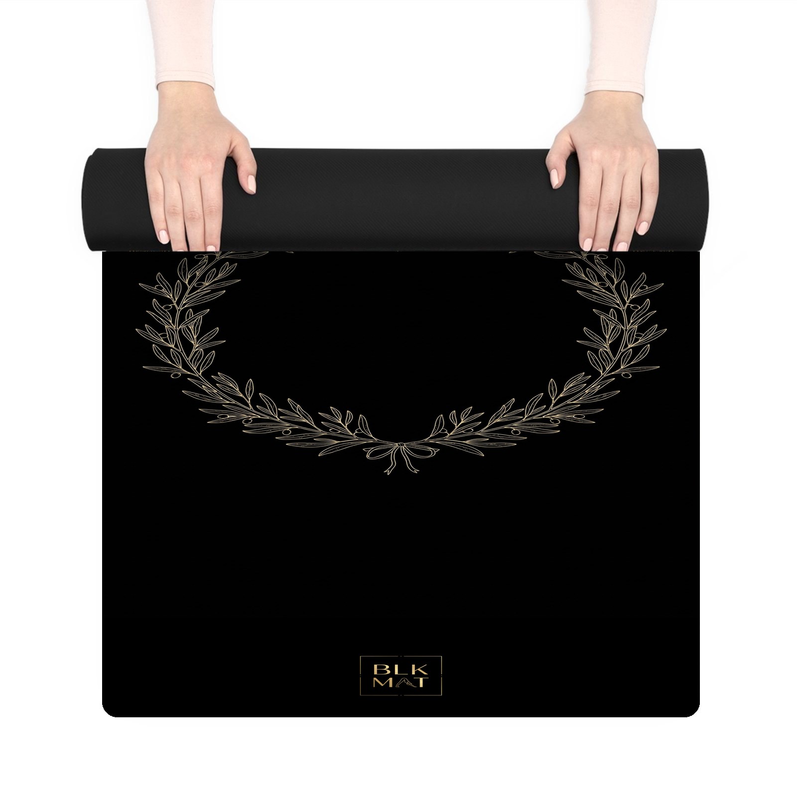 BLKMAT Olive Branch Wreath yoga mat, held up and partly rolled