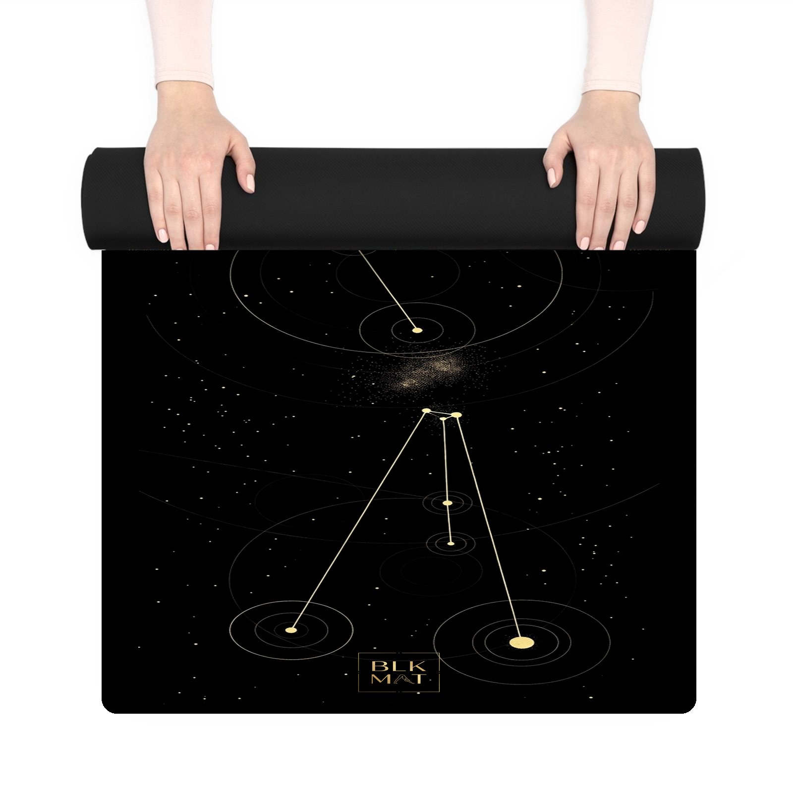 BLKMAT Orion Star Chart yoga mat, held up and partly rolled