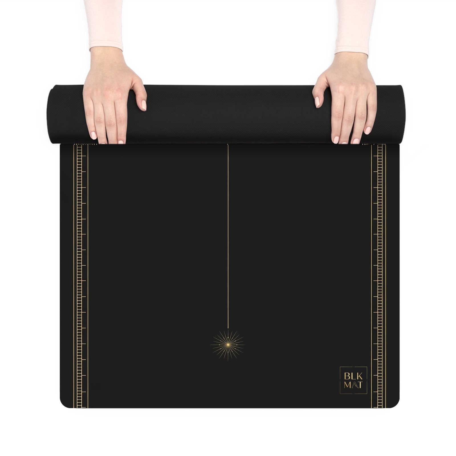BLKMAT Radiant Bindu yoga mat, held up and partly rolled