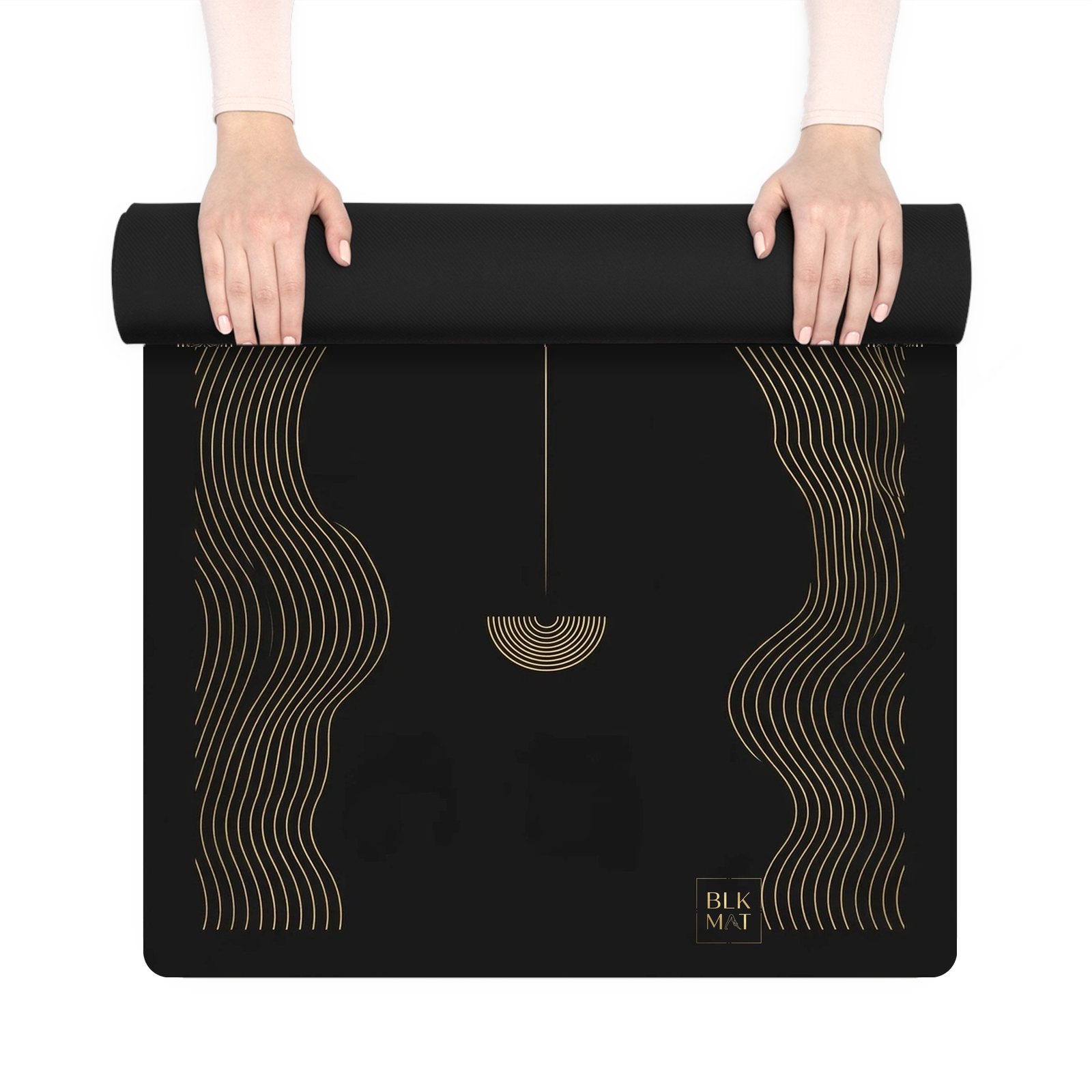 BLKMAT Ridgeline yoga mat, held up and partly rolled