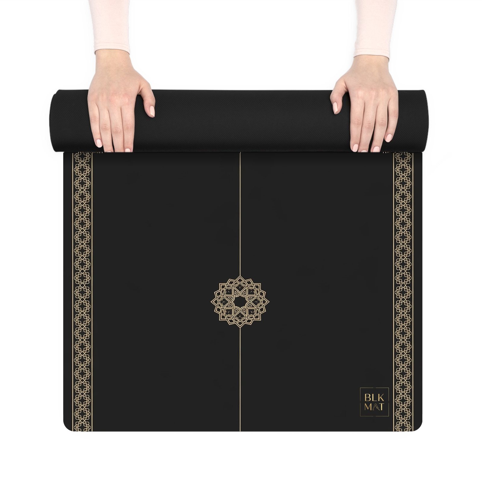BLKMAT Rosette Void yoga mat, held up and partly rolled