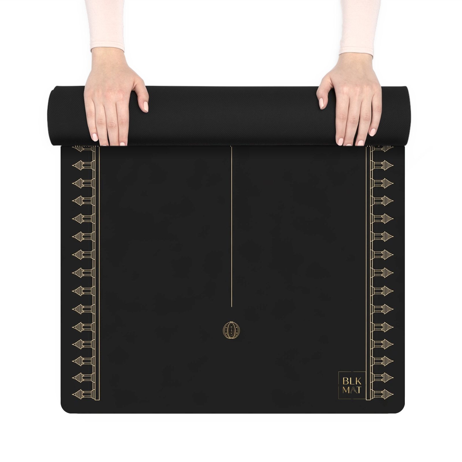 BLKMAT Sacred Bloom yoga mat, held up and partly rolled