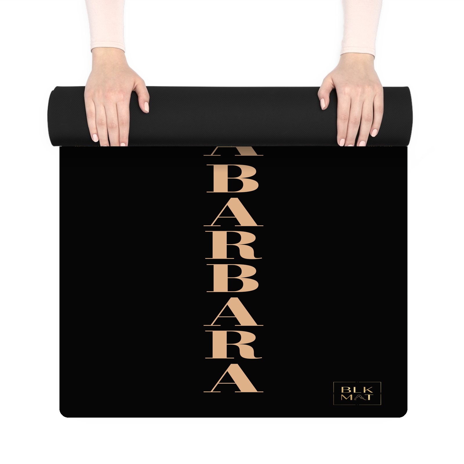BLKMAT Santa Barbara Letter Stack yoga mat, held up and partly rolled