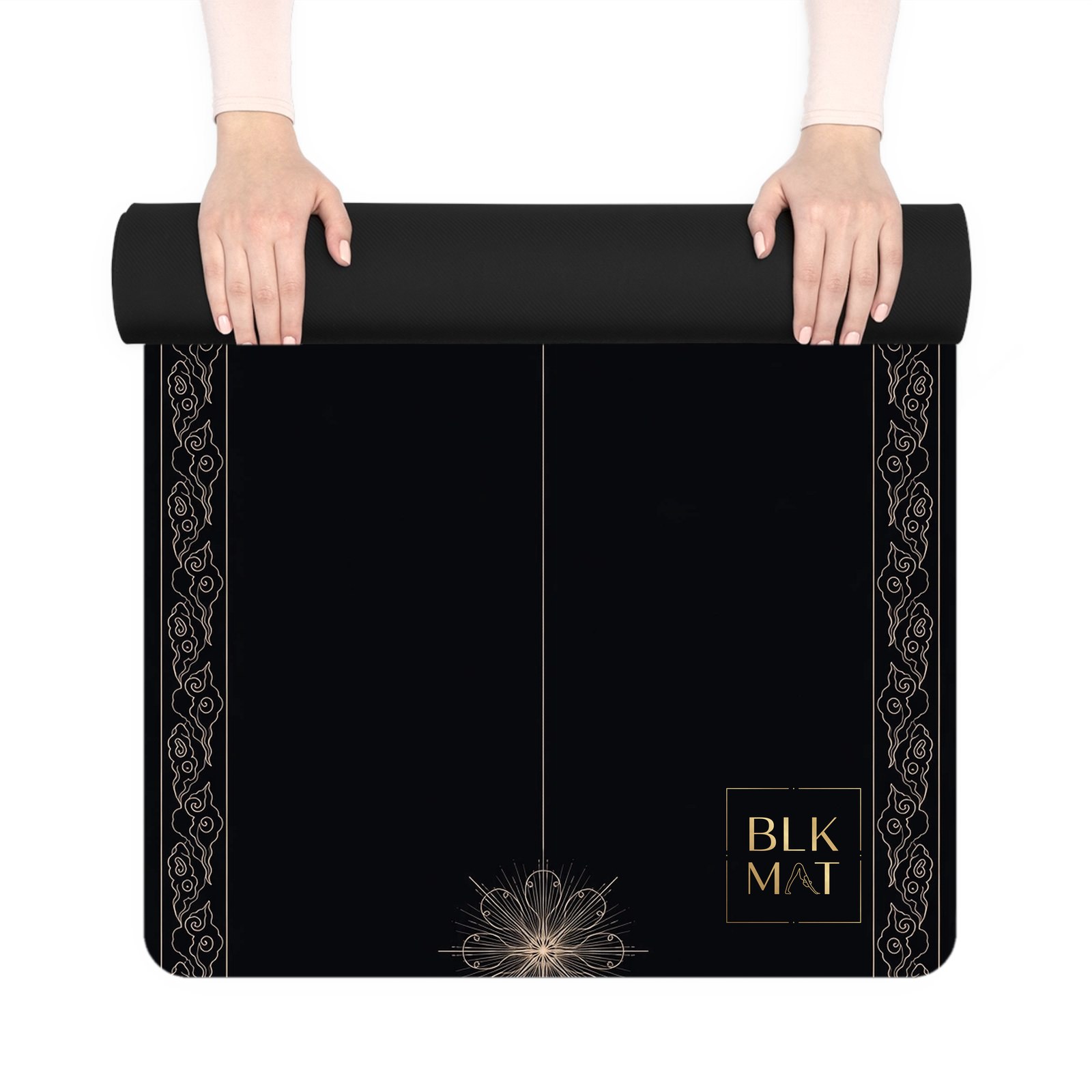 BLKMAT Whirling Ray yoga mat, held up and partly rolled