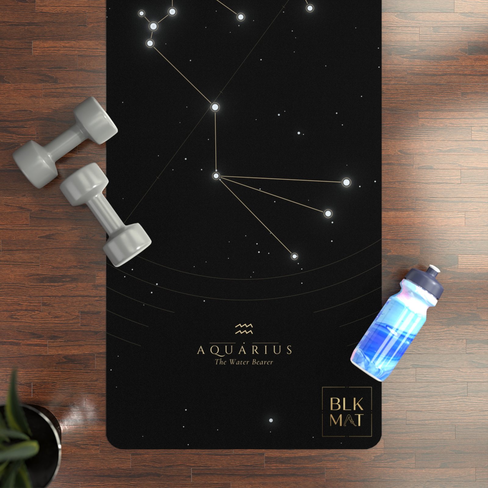 BLKMAT Aquarius Constellation yoga mat, flat lay on a wood floor