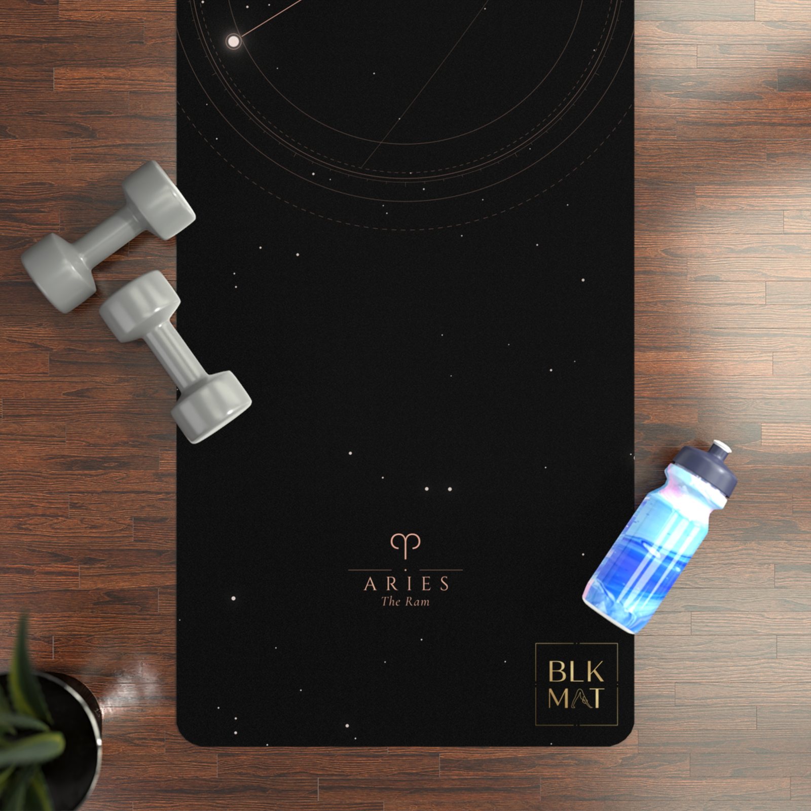 BLKMAT Aries Constellation yoga mat, flat lay on a wood floor