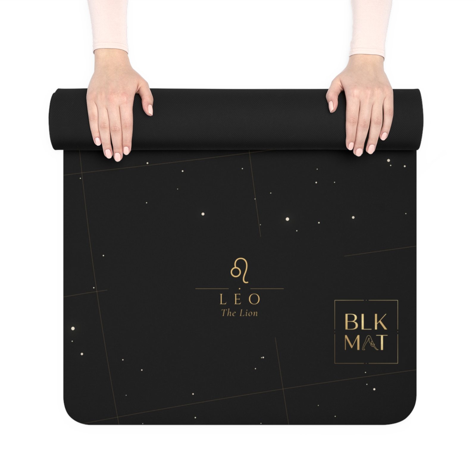 BLKMAT Leo Constellation yoga mat, held up and partly rolled