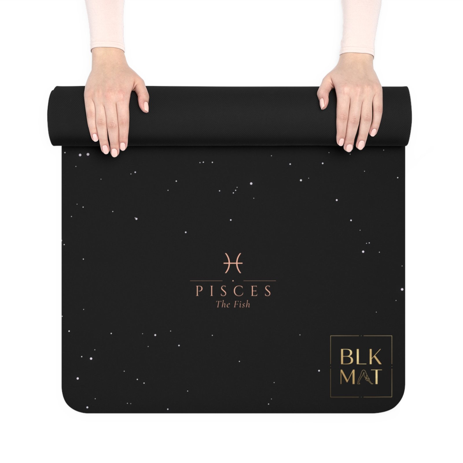 BLKMAT Pisces Constellation yoga mat, held up and partly rolled