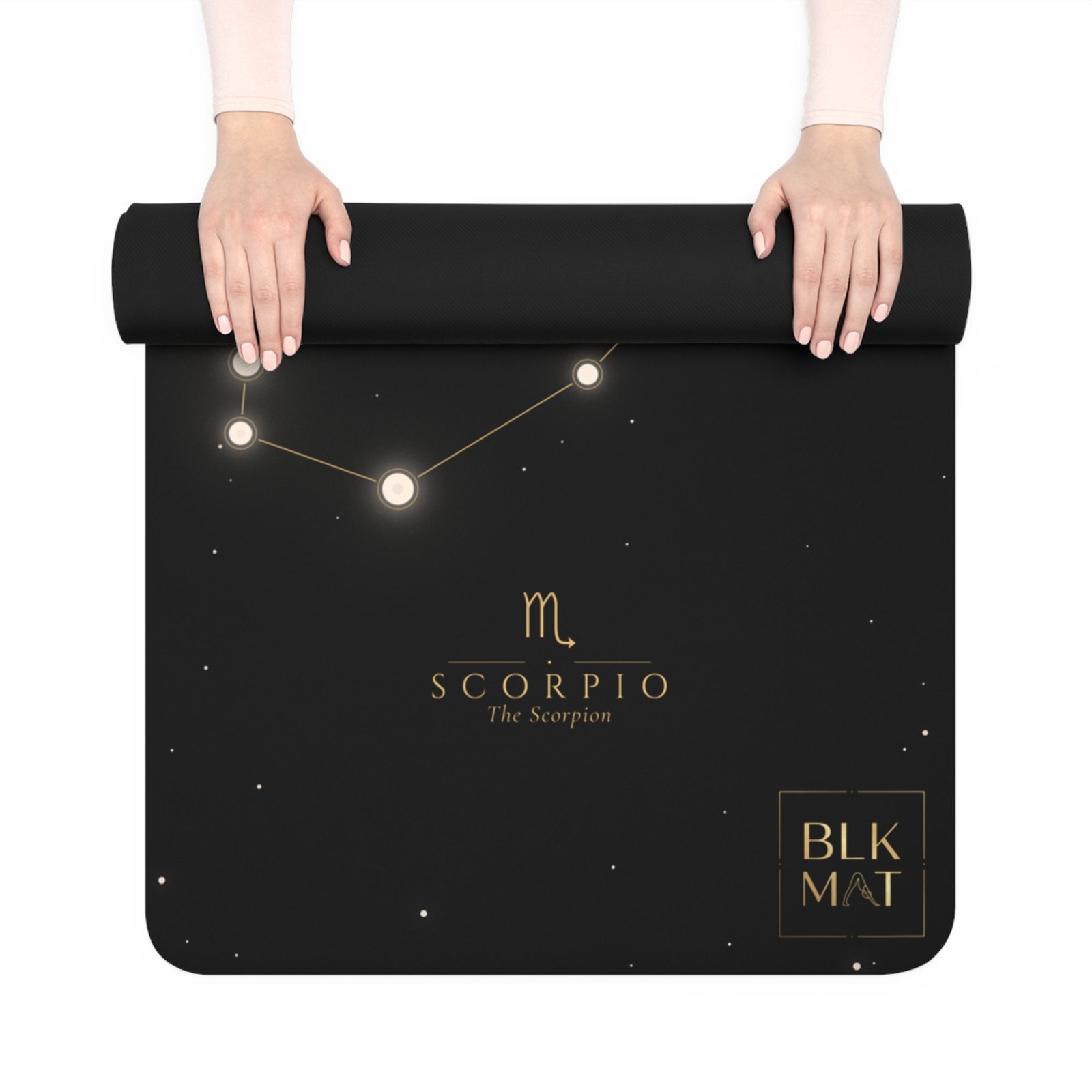 BLKMAT Scorpio Constellation yoga mat, held up and partly rolled