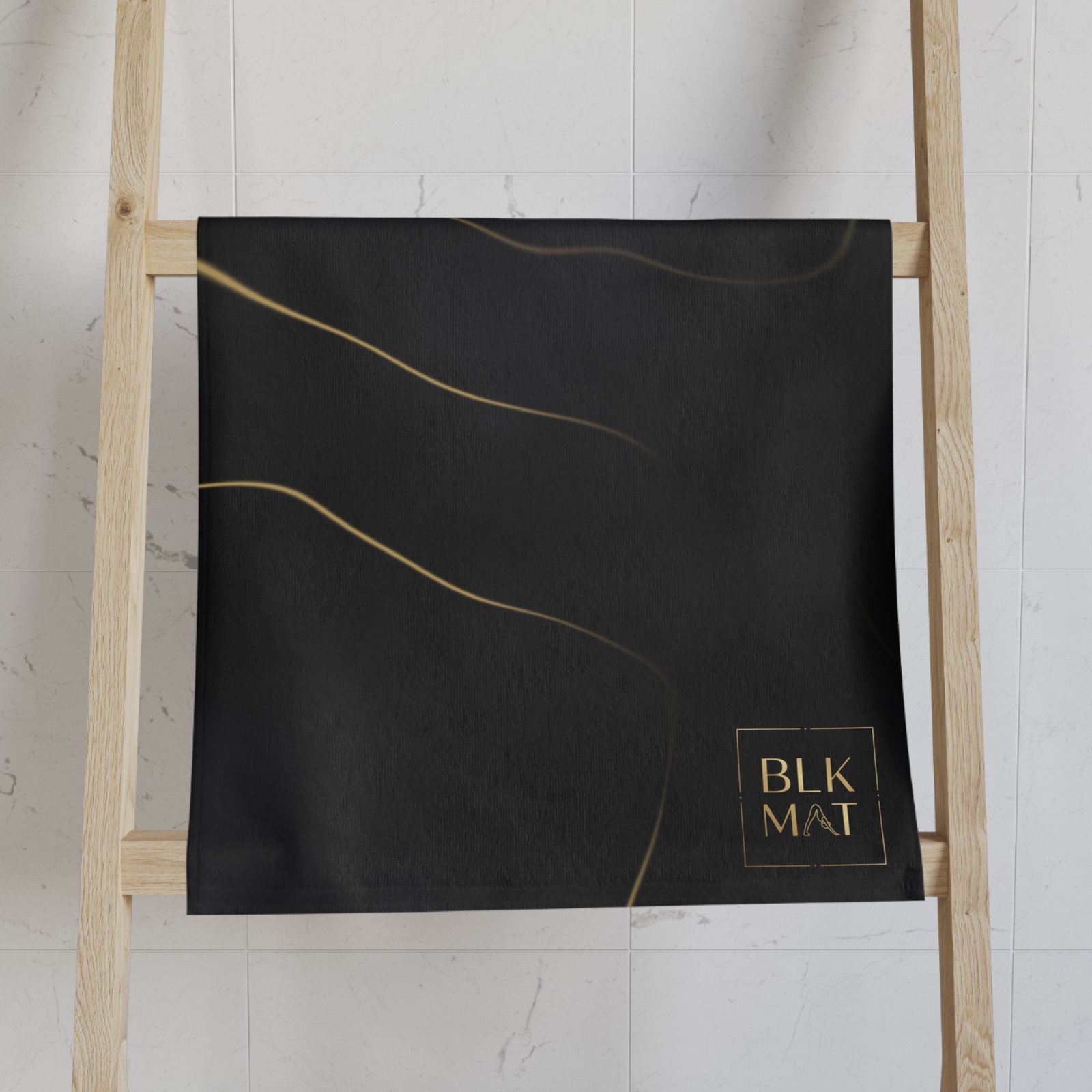 BLKMAT Black Marble, Gold Vein Hand Towel, on a towel ladder