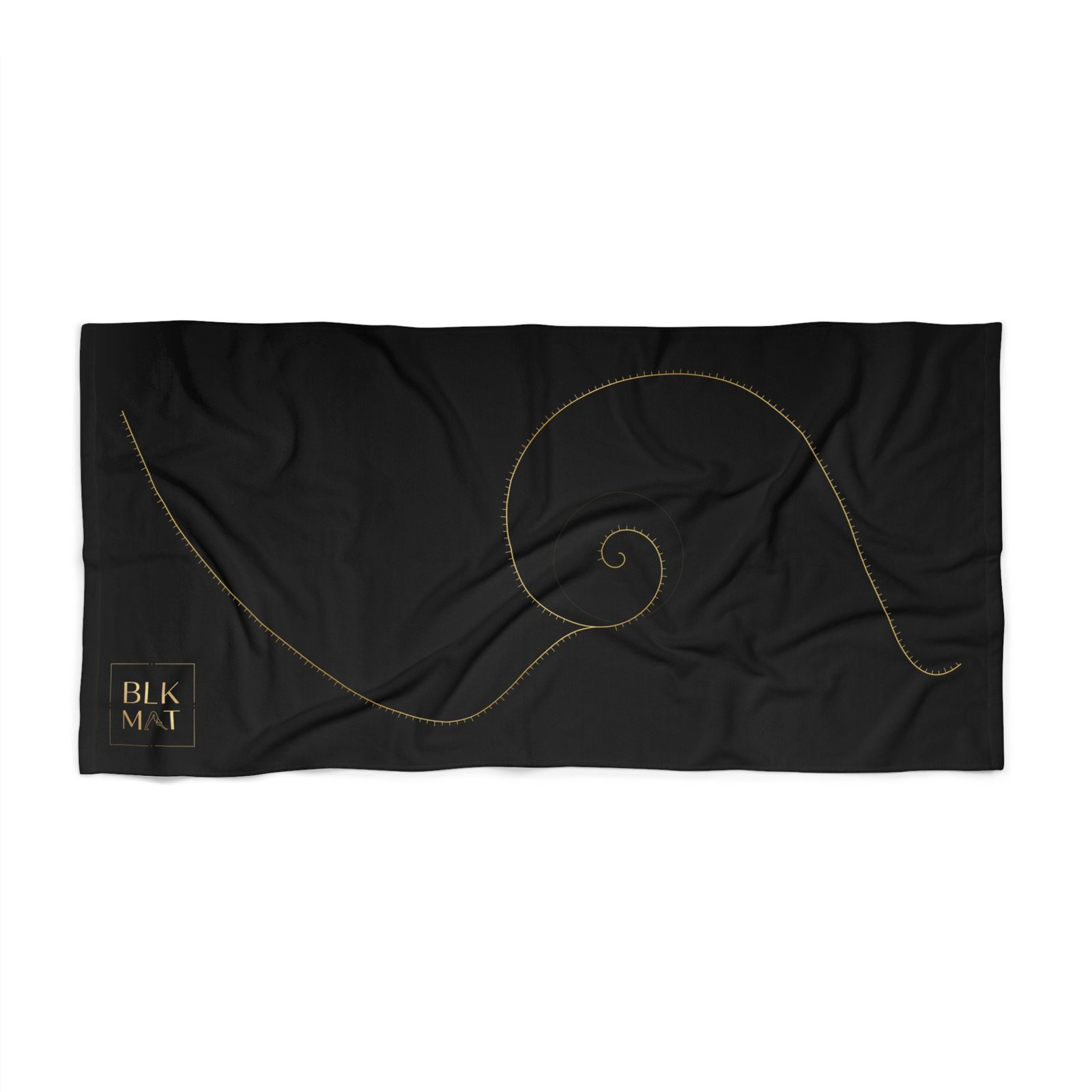 Black beach towel with a long, fine gold golden-ratio spiral sweeping across it and a small gold BLKMAT logo in the bottom-left corner.
