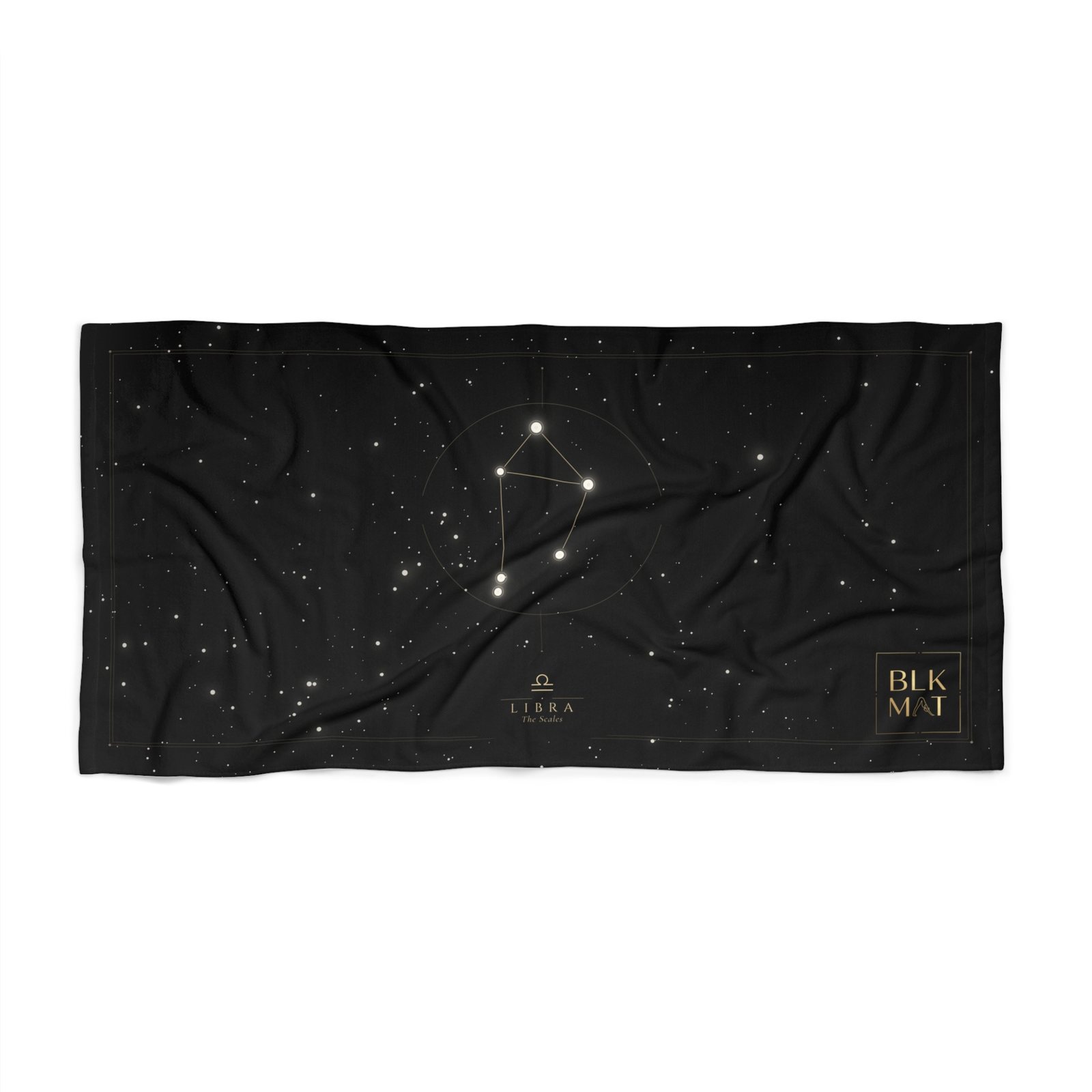 Black beach towel with the Libra constellation drawn as a white star chart in a thin circle on a starry field, the caption LIBRA The Scales, and a small gold BLKMAT logo in the bottom-right corner.