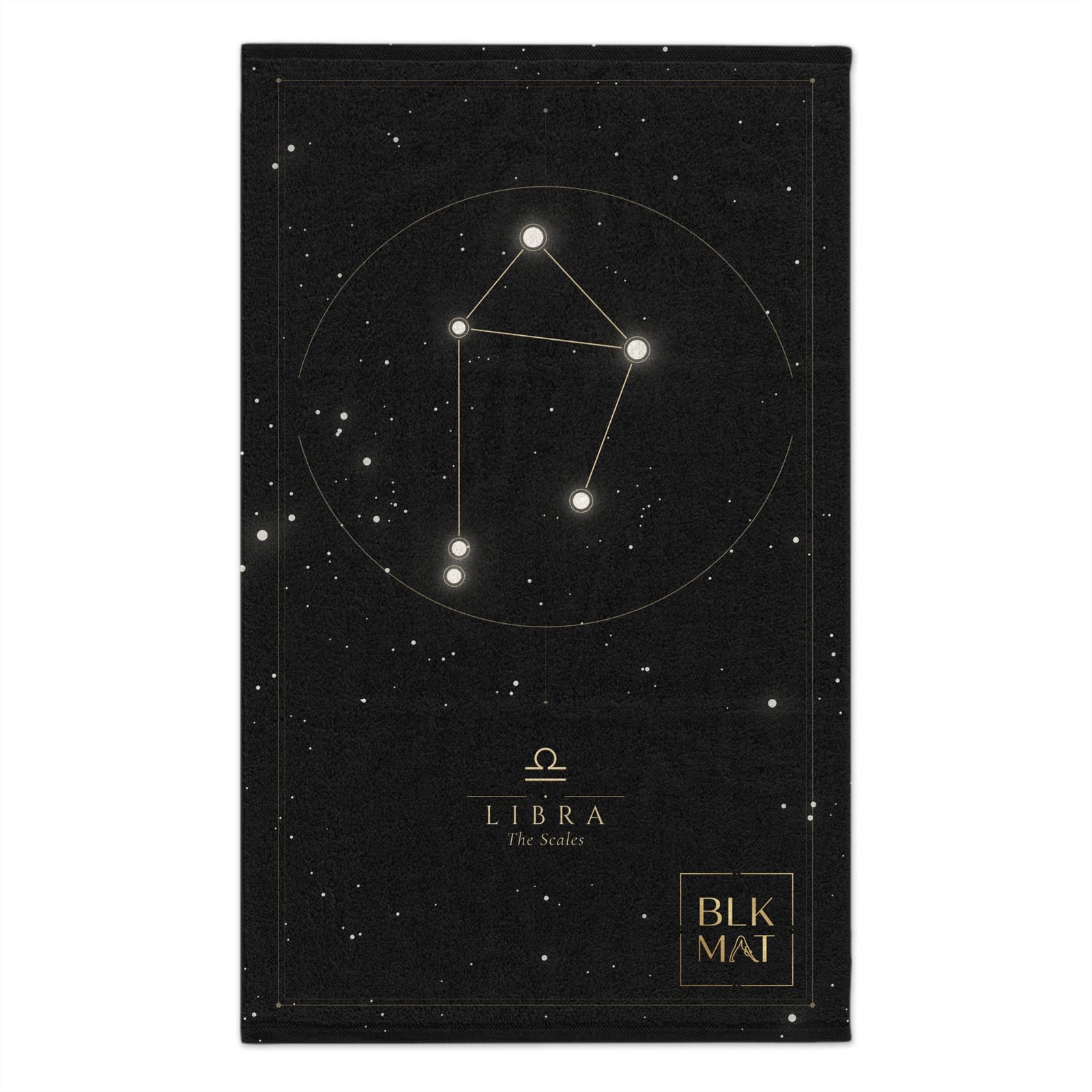 Small black gym towel with the Libra constellation drawn as a white star chart in a thin circle, the caption LIBRA The Scales, and a small gold BLKMAT logo in the bottom corner.